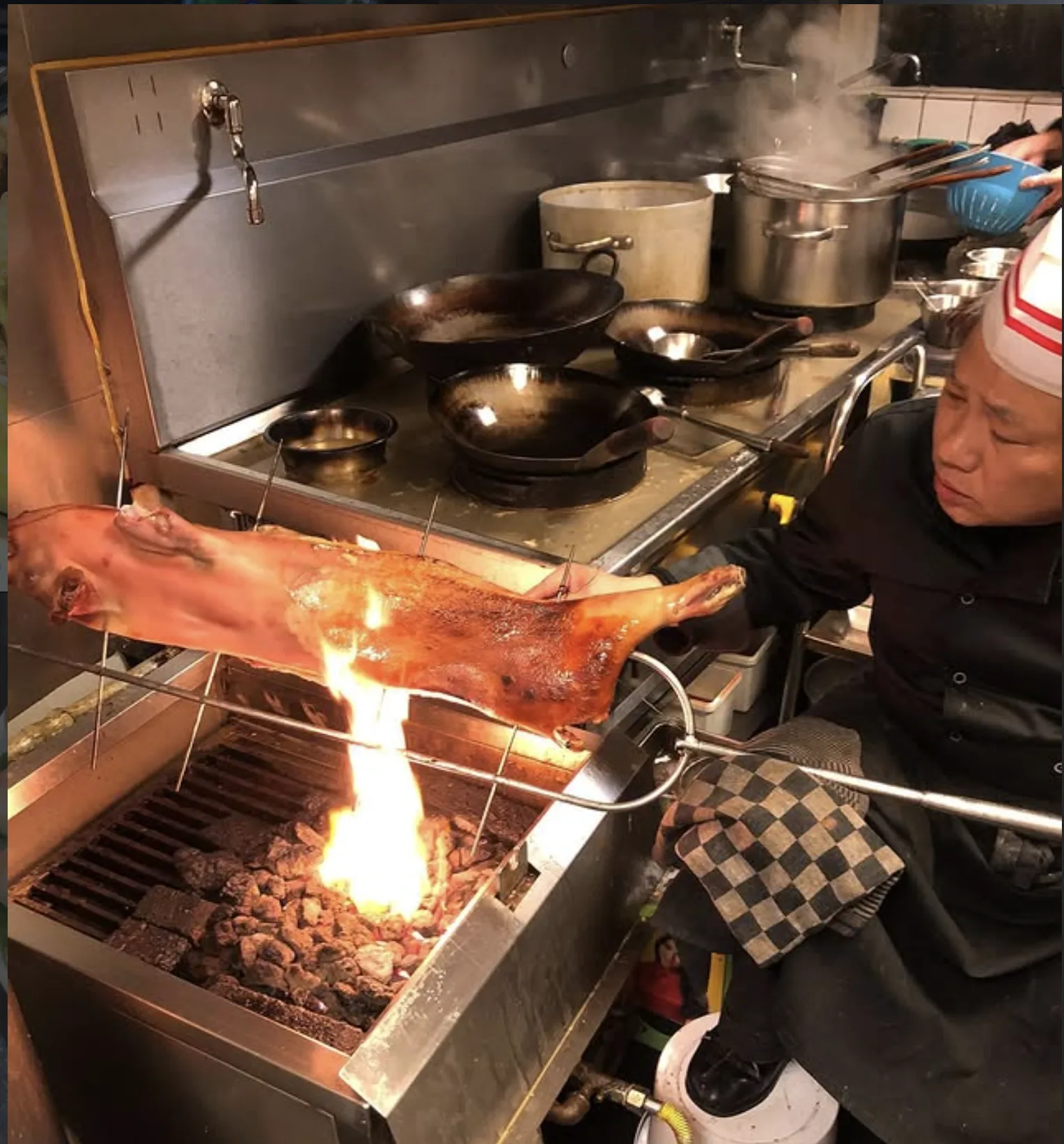 Kitchen at Little Asia with flames during dish preparation